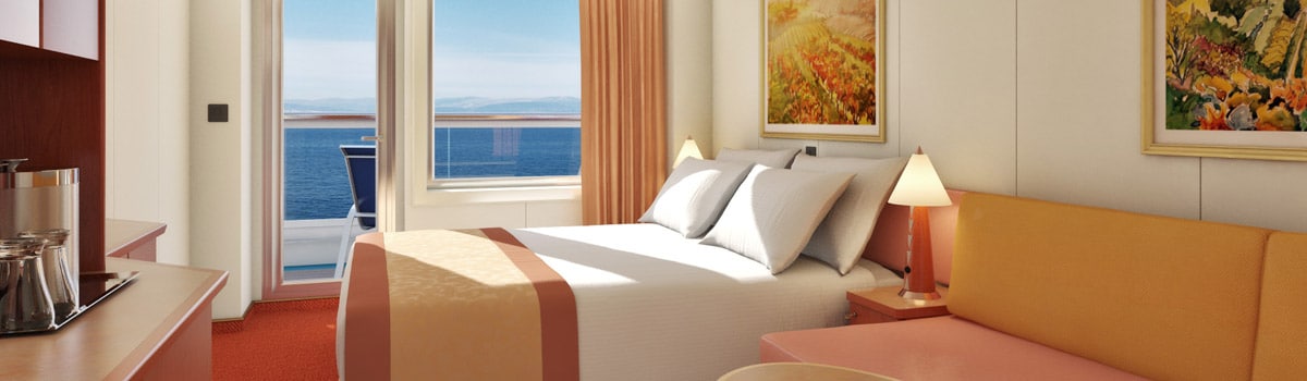 Carnival Conquest Balcony stateroom — representative Carnival photo