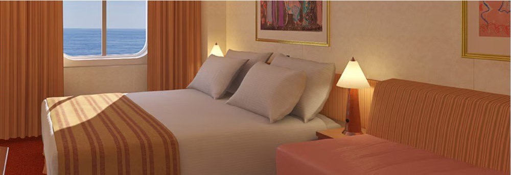 Carnival Pride Ocean View stateroom — representative Carnival photo